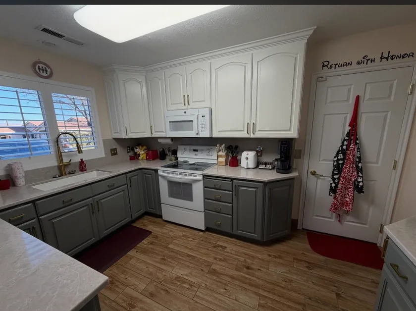Two-tone painted cabinets with white uppers and grey lowers